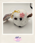 White plush keychain with a pink flower on a white background