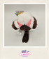 Plush toy with a tag on a light gray background