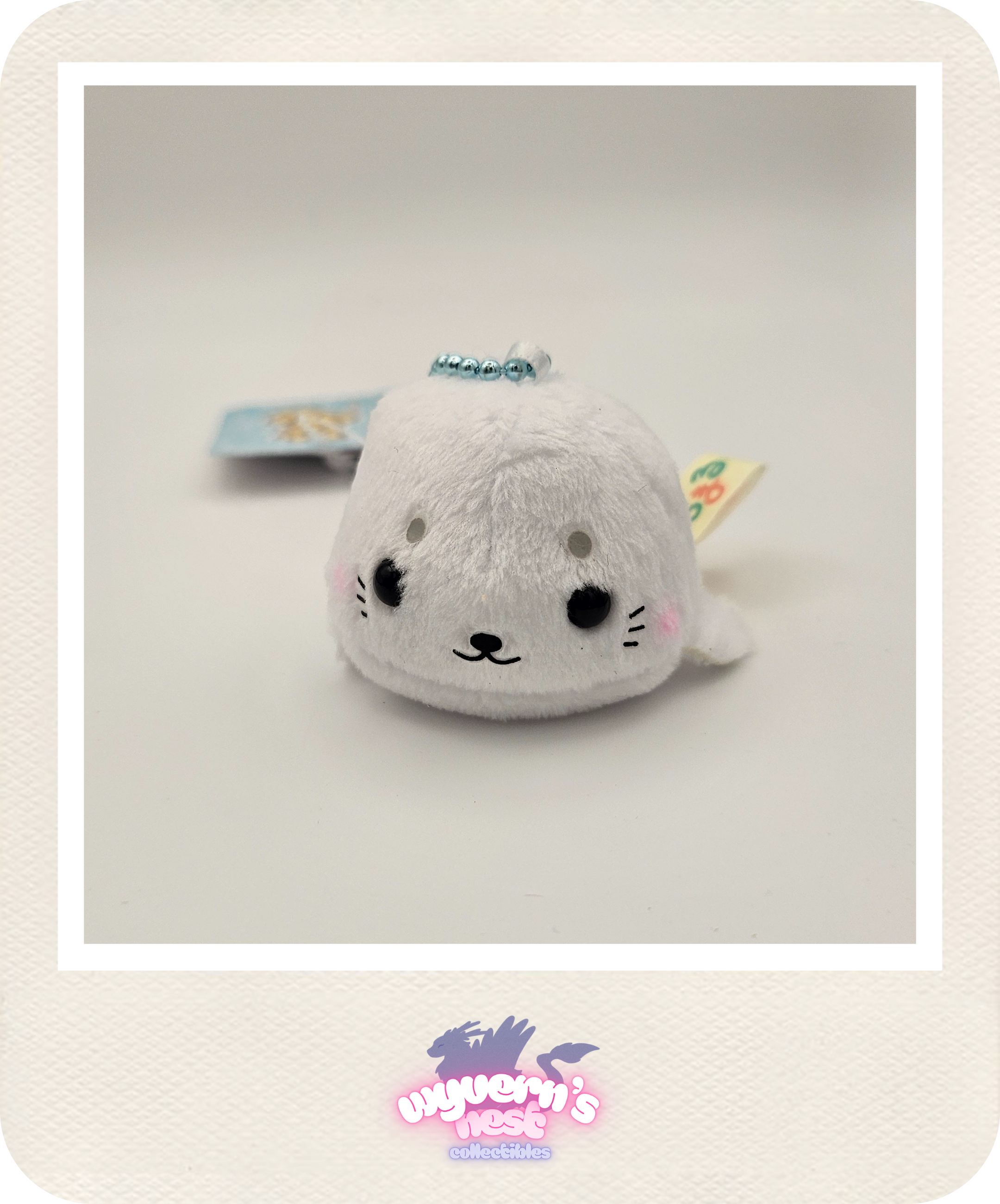 Plush toy resembling a seal with a white background