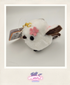 Plush keychain with a cherry blossom design on a light gray background