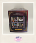 Product packaging with toy figures and decorative elements on a light background