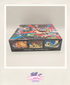 Colorful trading card game box with character illustrations on a plain background