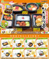 Promotional display of miniature bento boxes with various food items and packaging.