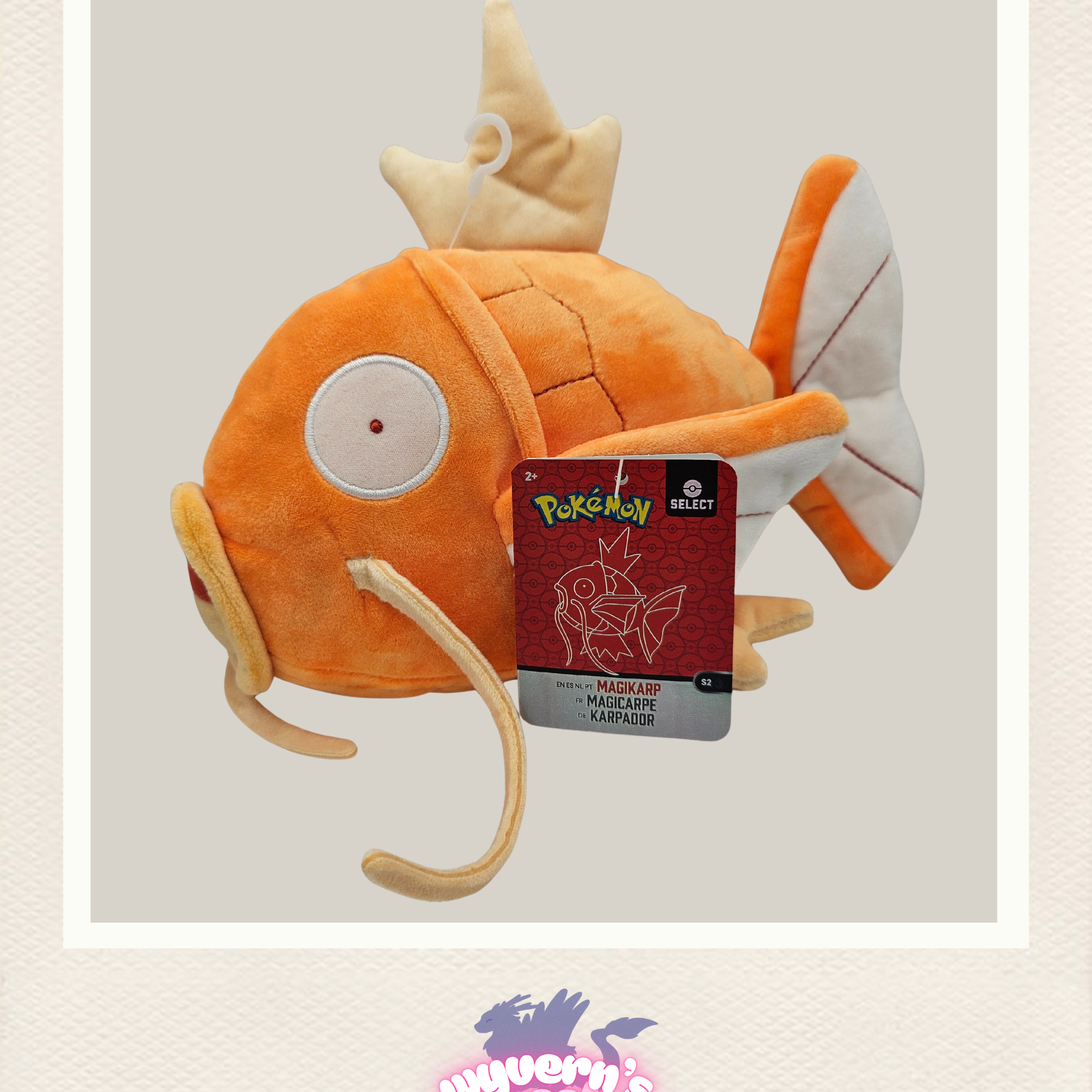 Plush toy Magikarp on a light gray background