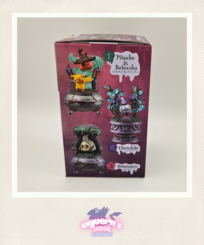 Boxed set of Pikachu and Bulbasaur figurines with a purple background